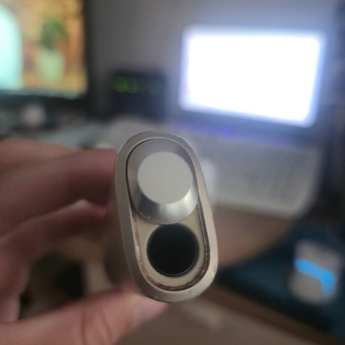 Iqos ILUMA One Gold device used with box and cable