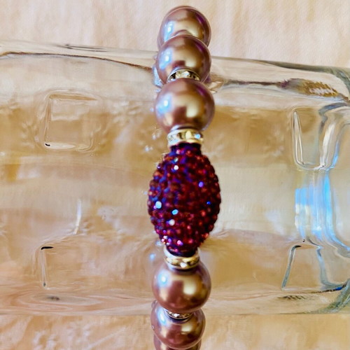 Handmade bracelet new with mauve glass pearls and purple decorative bead