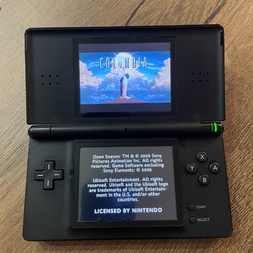 Nintendo DS Lite used, black with cartridge and original charger