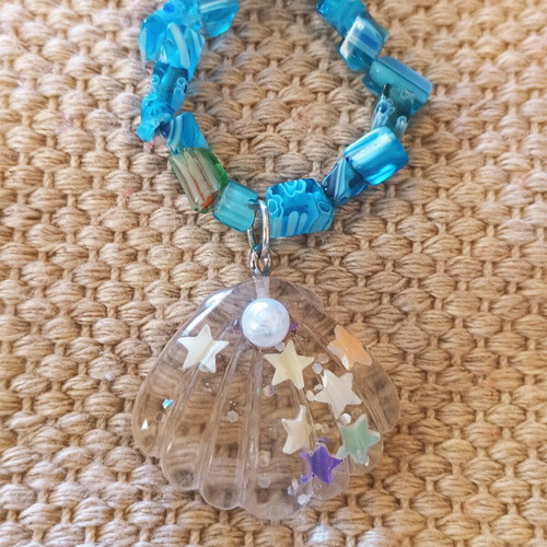 Handmade turquoise necklace with beads and transparent shell