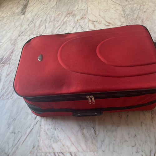 Dolphin suitcase like new, 50-65 lt, black and red