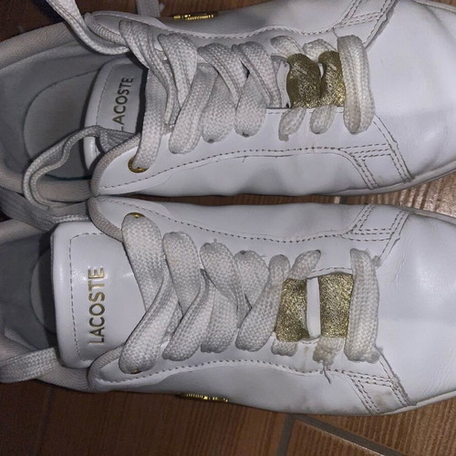 Lacoste sneakers used leather with gold details