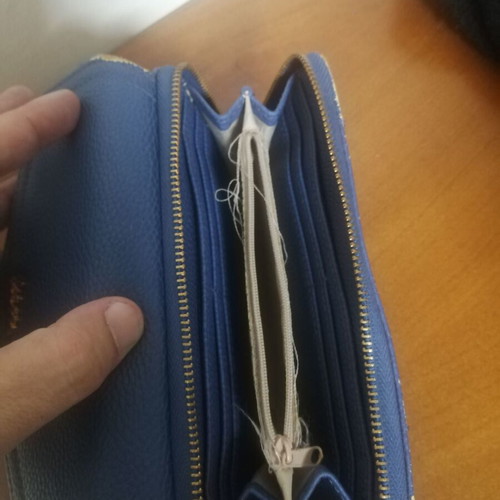 KEM wallet used, blue with multiple compartments