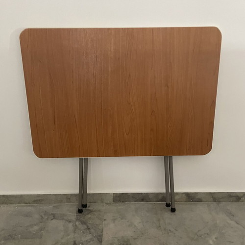 Folding table used with metal base and brown melamine top