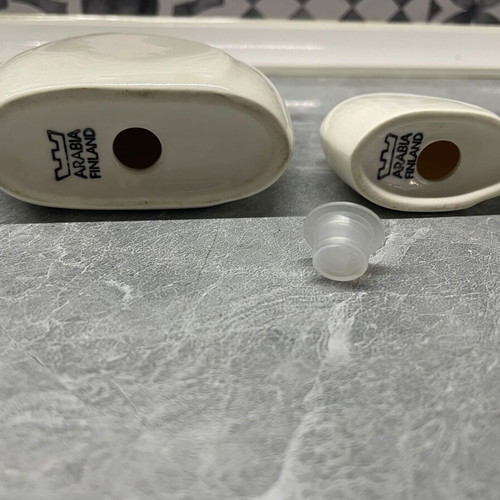 Arabia salt and pepper shakers set used, big and small size, one missing cap
