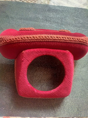 Red telephone cover used for old telephone