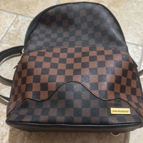 Sprayground backpack like new, brown and black
