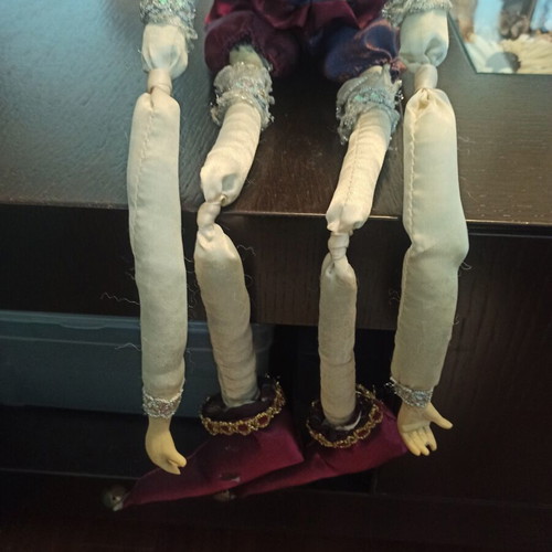 Wind-up Pierrot Harlequin doll used with music