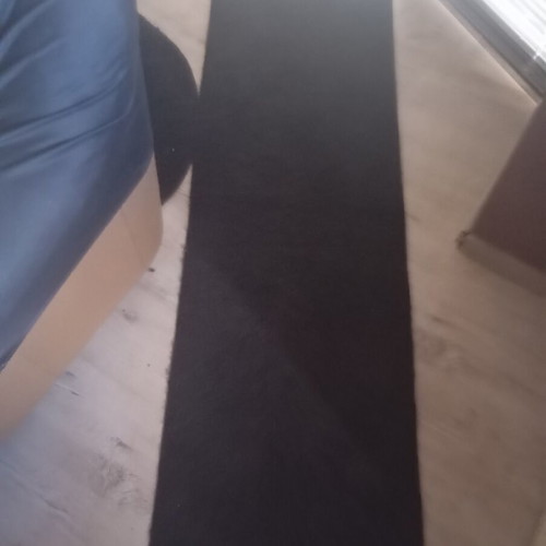 Black interior vintage runner rug used, minimalist design