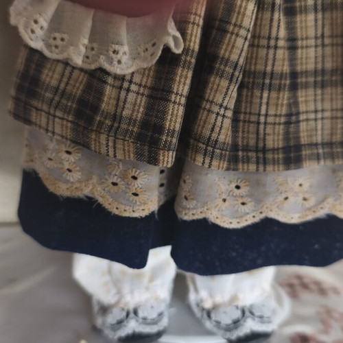 Porcelain doll vintage collective used with dress stains