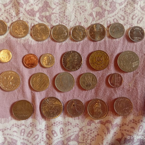 Various old coins like new from France, Canada, Tunisia, Italy, Germany, Spain