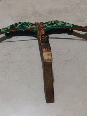 Crossbow toy used with extra holders and target