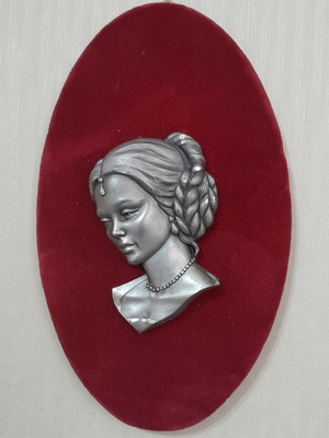 Vintage wall plaque with a beautiful girl in baroque style used