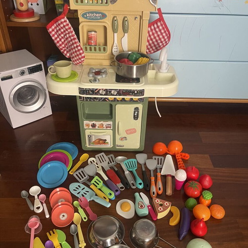 Children's play kitchen with many accessories