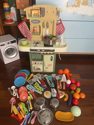Children's play kitchen with many accessories