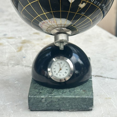 Decorative globe made of semi-precious stones with clock and marble base used