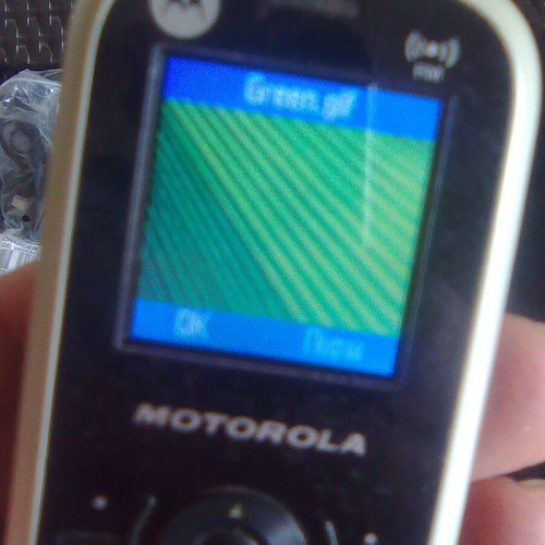 Motorola WX181 like new mobile phone with charger, headphones, and box