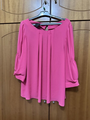 Access fuchsia blouse used with pleated front and puff sleeves