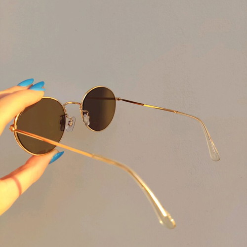 Sunglasses with blue mirror lenses and gold frame
