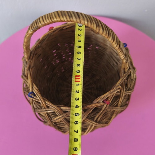 Handmade woven basket used with handle and decorative beads