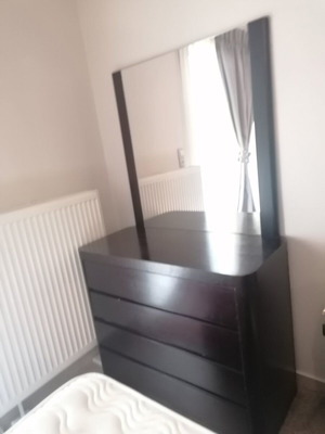 Bedroom set like new with mirror, dresser, and two nightstands