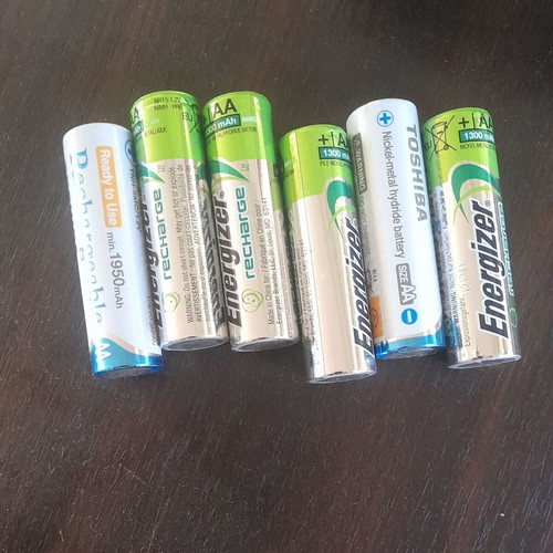 Rechargeable AA batteries with 4-slot charger like new