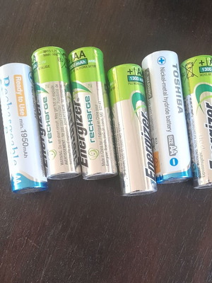 Rechargeable AA batteries with 4-slot charger like new