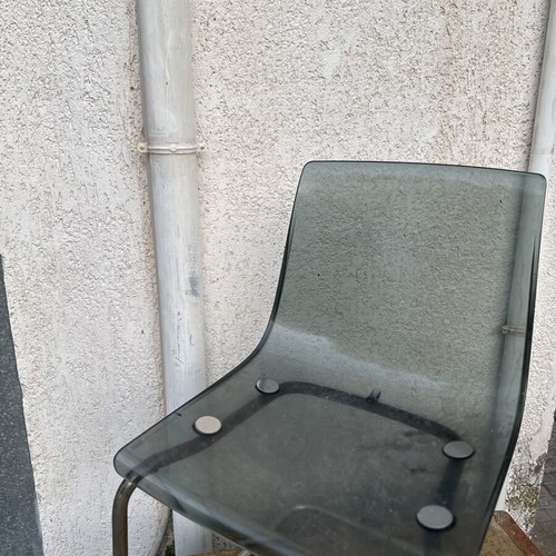 Transparent chair with tinted seat and chrome metal frame