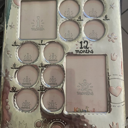 Silver photo frame new, slight tear on back plastic