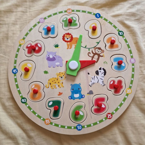 Wooden clock puzzle used with marker stains