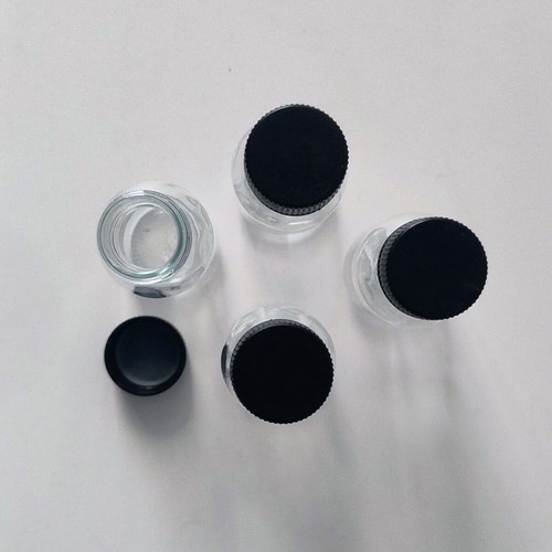 Set of 4 glass bottles 50ml with black screw plastic cap