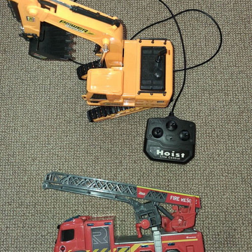 Set of remote control children's vehicles used, excavator and fire truck