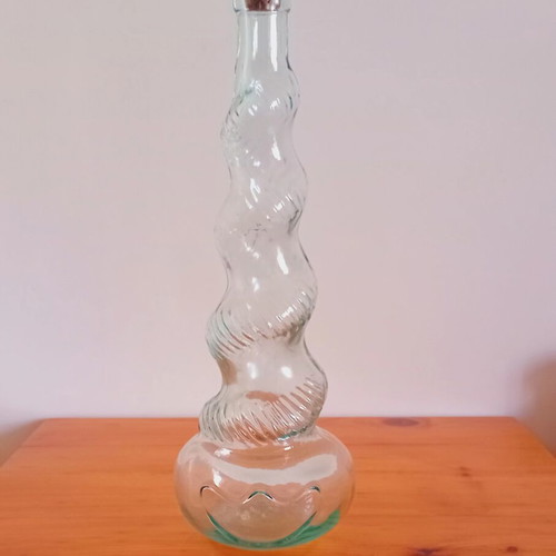 Collectible vintage glass bottle with twisted design like new