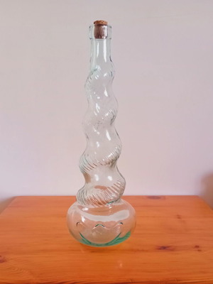 Collectible vintage glass bottle with twisted design like new