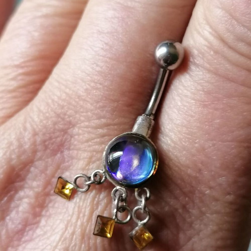 Aurora borealis navel piercing with color-changing crystal