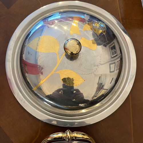 Serving dish made of steel with gold details like new