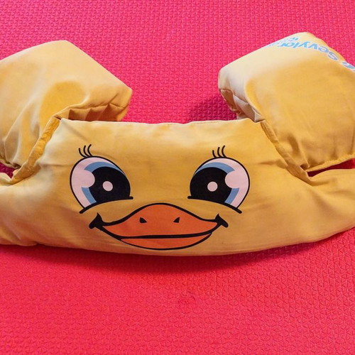 Child life jacket with integrated armbands used
