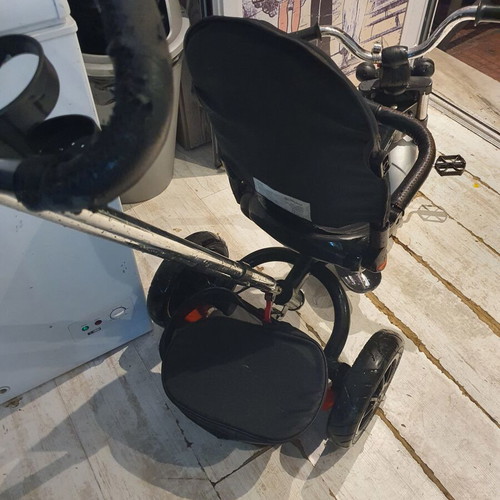 Tricycle used with some fabric wear and missing parts
