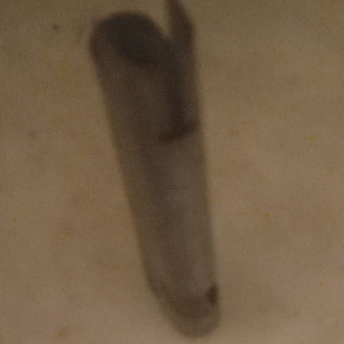 Metal case for flat lighter used with visible signs of wear