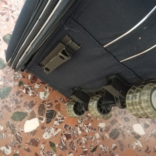 Lumi travel suitcase used with broken wheels