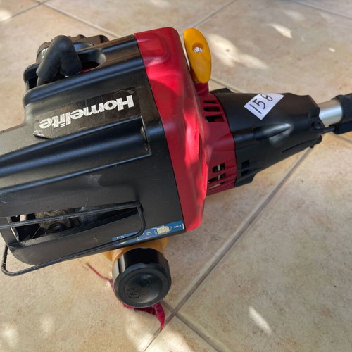 Homelite F3055 Petrol Lawn Mower used with accessories