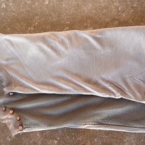 Women's sleeveless blouse gray like new, size small with studs and holes