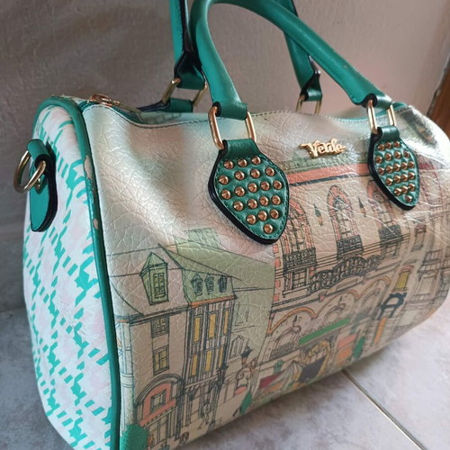 Verde handbag like new, turquoise with urban patterns