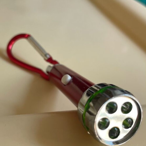 Keychain flashlight like new, requires 4 batteries
