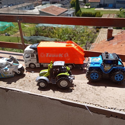 Lot of 4 used medium-sized children's toy vehicles