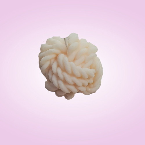 Soy wax candle in knitted skein shape with vanilla praline scent
