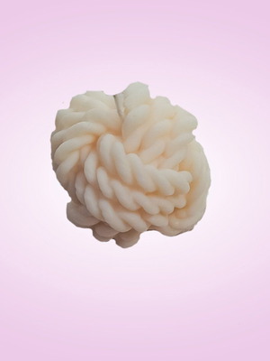 Soy wax candle in knitted skein shape with vanilla praline scent