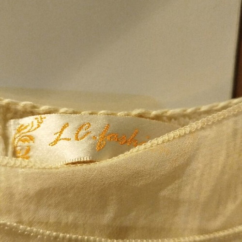 Women's blouse used, size M, ecru color