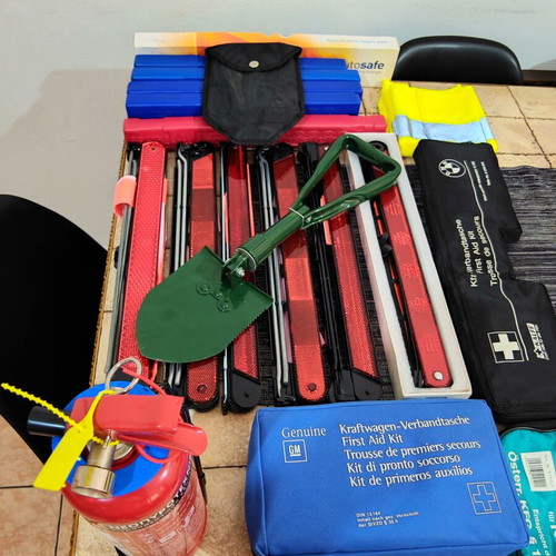 Car safety kit with fire extinguisher, triangles, first aid kits, shovel, vest