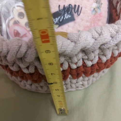 Knitted basket like new with gifts made of macrame cord